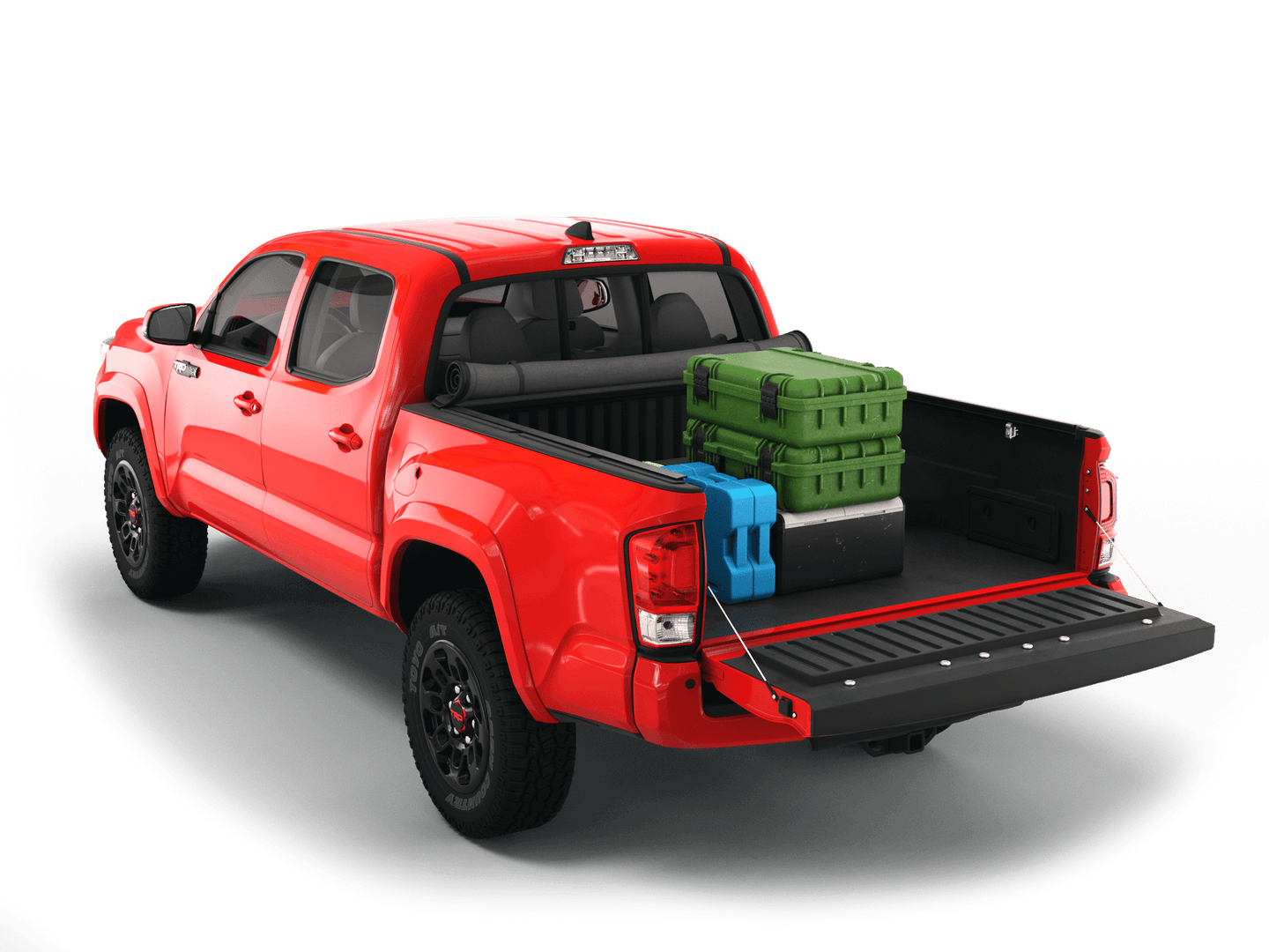 Red Toyota Tacoma with gear in the truck bed and the Sawtooth Stretch tonneau cover rolled up at cab